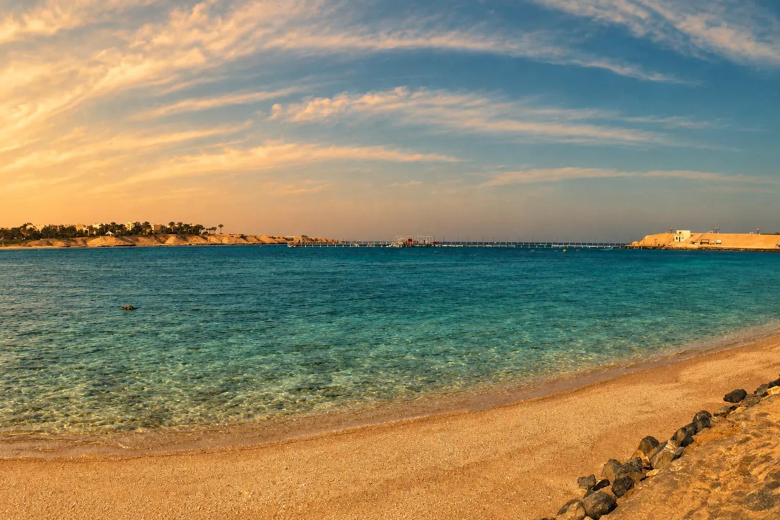 Calm shallow water and a sandy shore at Coraya Bay on the Red Sea coast