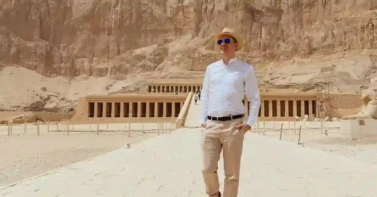 Man standing before the Hatshepsut temple