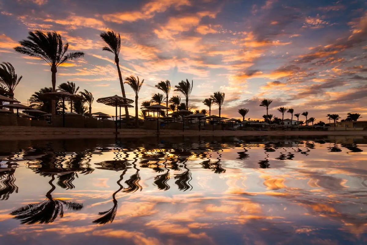 Sunset over a sandy Red Sea beach in Egypt