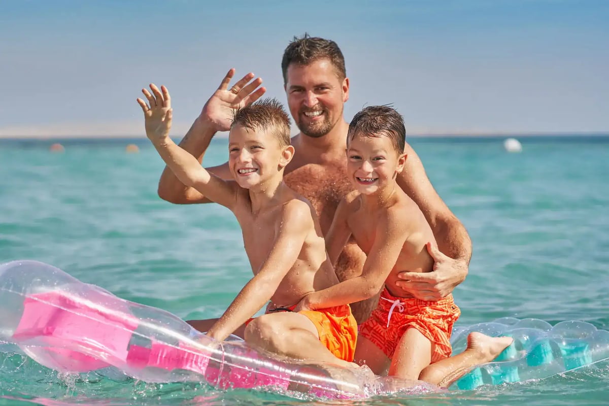 Father Playing in the Sea on Inflatable Mattress Egypt Hurghada