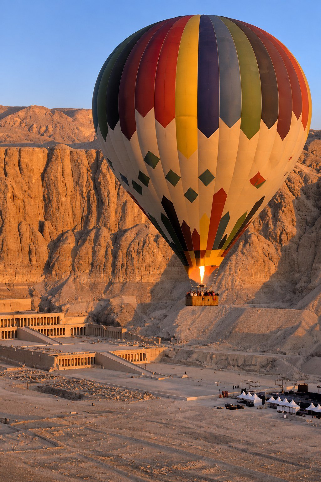 Sunrise hot air balloon over Luxor West Bank, above Hatshepsut Temple at Deir el-Bahari