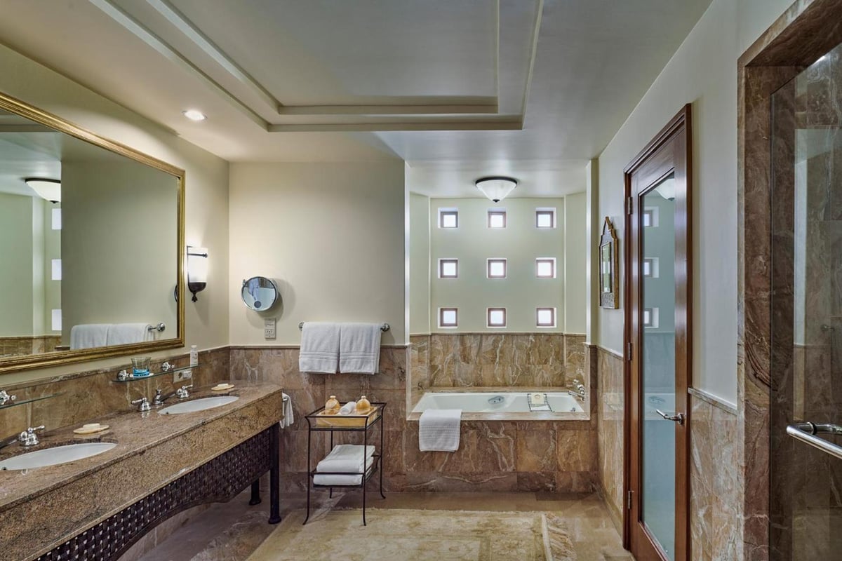 Four Seasons Resort Sharm El Sheikh bathroom with a marble vanity and a built-in tub.