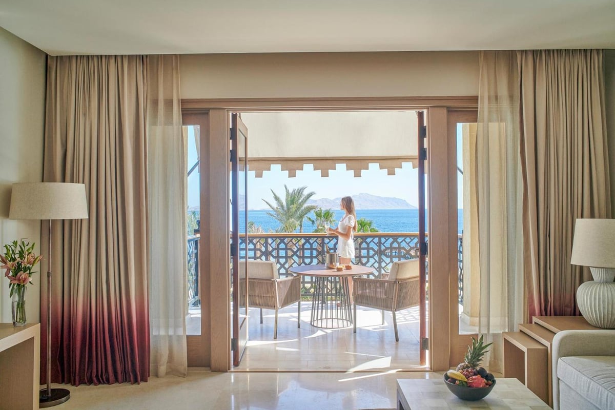 Four Seasons Resort Sharm El Sheikh guest room with open balcony doors and a sea view.