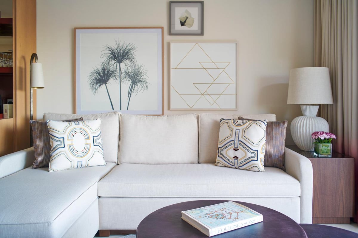 Four Seasons Resort Sharm El Sheikh sitting area with a pale sofa and framed artwork.