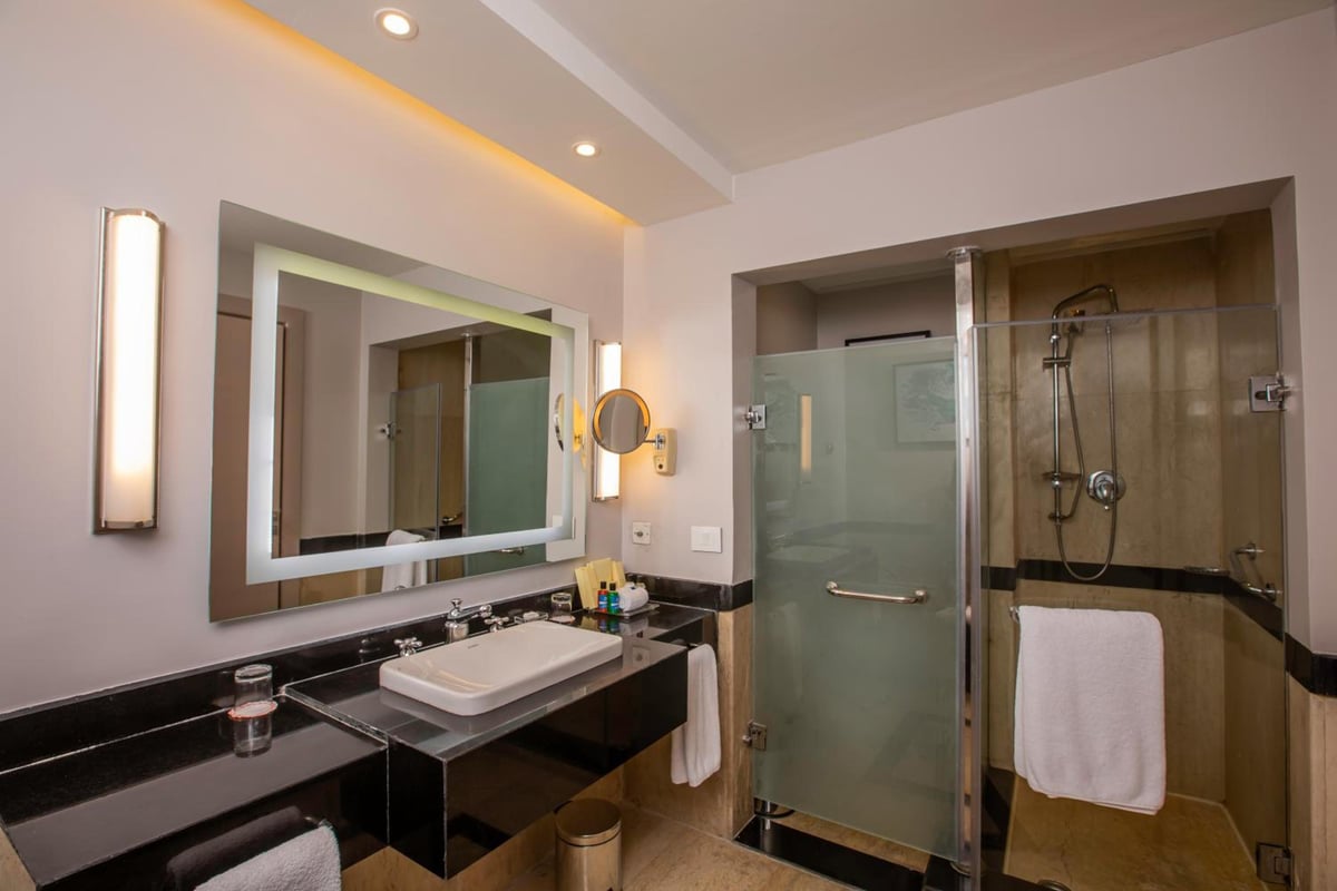 Park Regency Sharm El Sheikh Resort bathroom with a glass shower and a vessel sink.