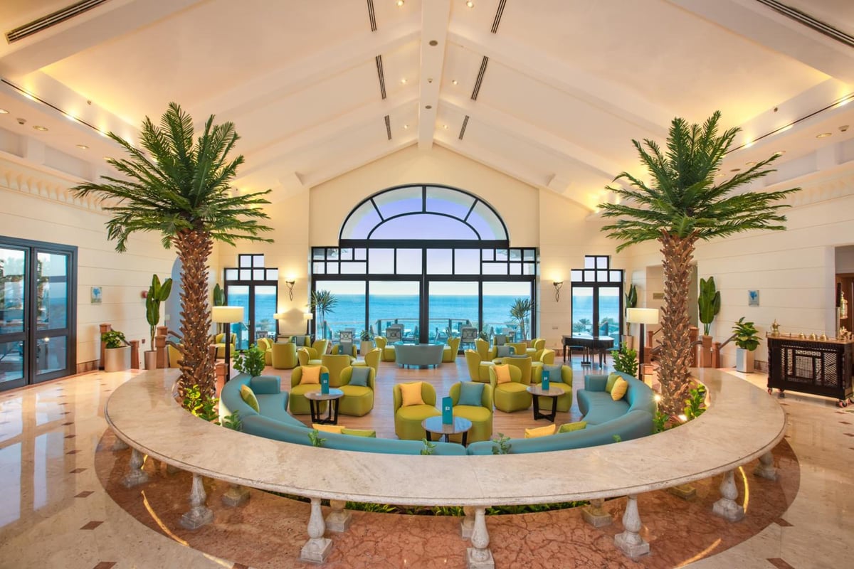 Park Regency Sharm El Sheikh Resort lobby with curved seating and arched windows.