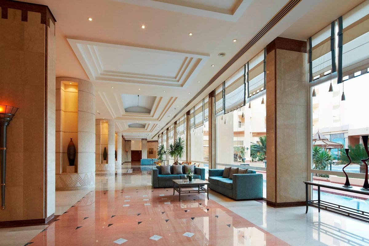 Marriott Hurghada Beach Resort lobby with floor-to-ceiling windows and seating areas.