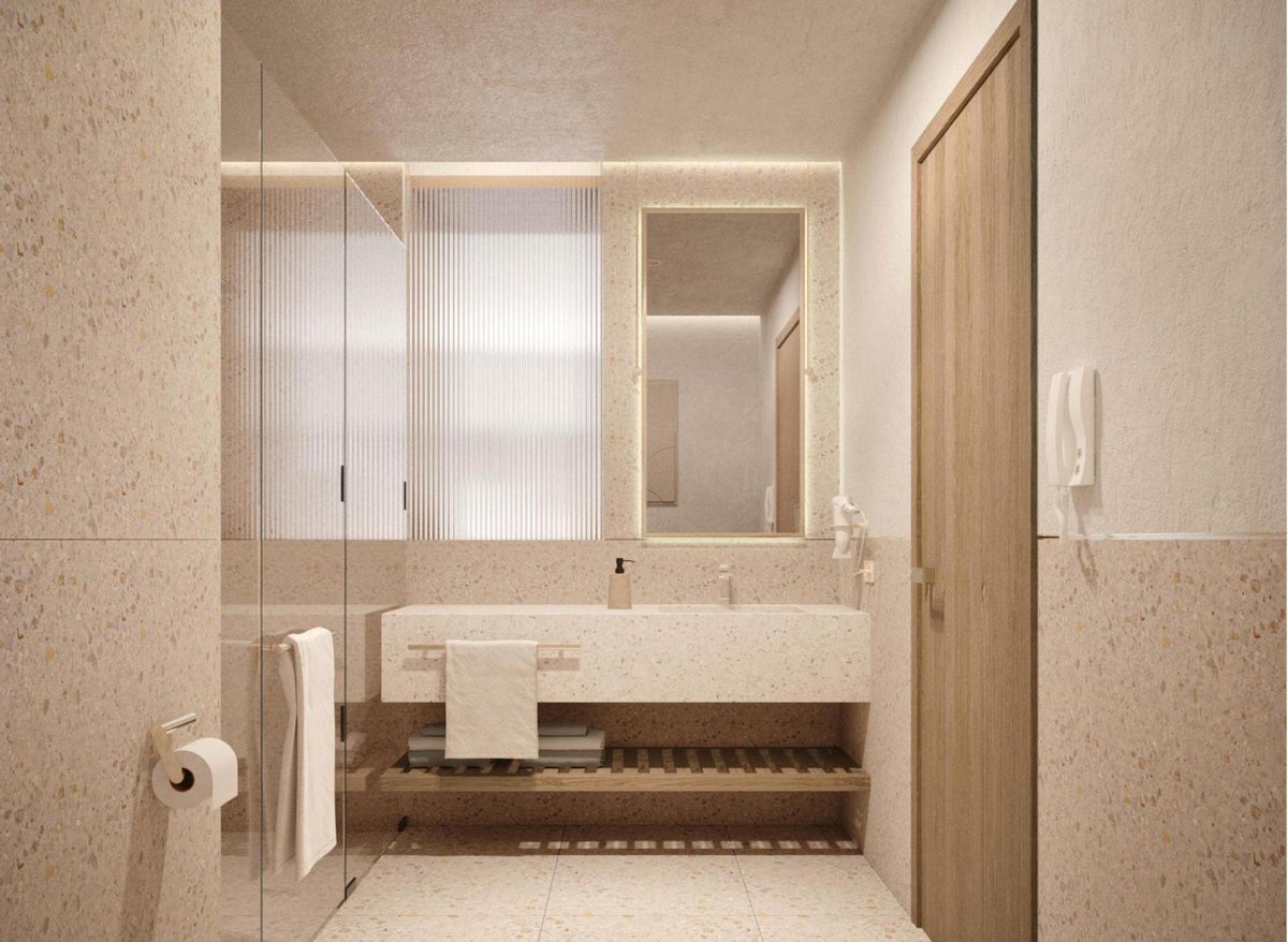 Baron Resort Sharm El Sheikh bathroom with a glass shower and stone vanity.