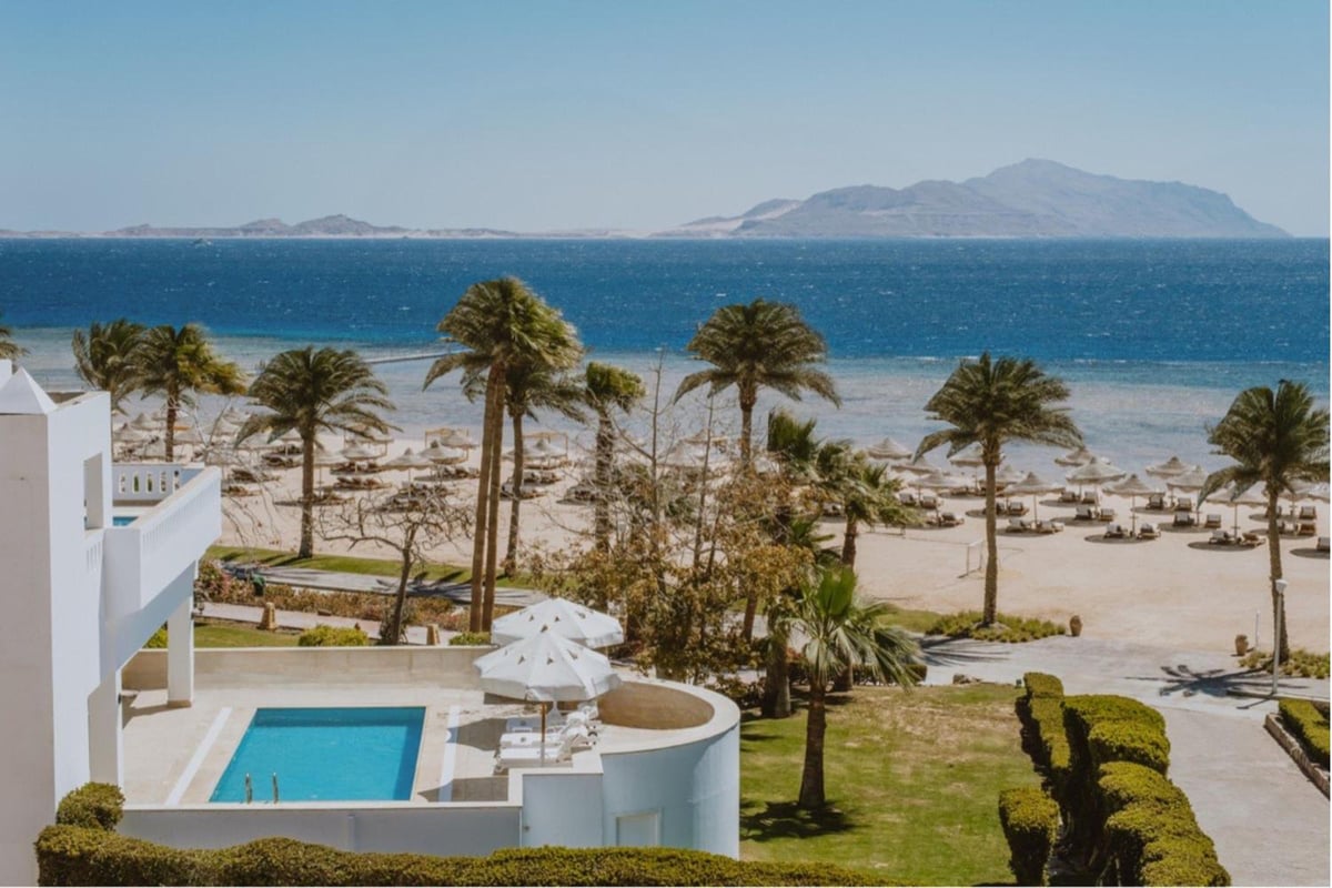 Baron Resort Sharm El Sheikh pool terrace with a rectangular pool and sea views.