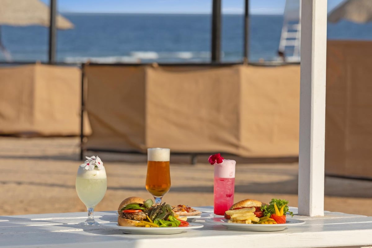 Pickalbatros Sands Port Ghalib outdoor dining area with sea views and food and drinks.