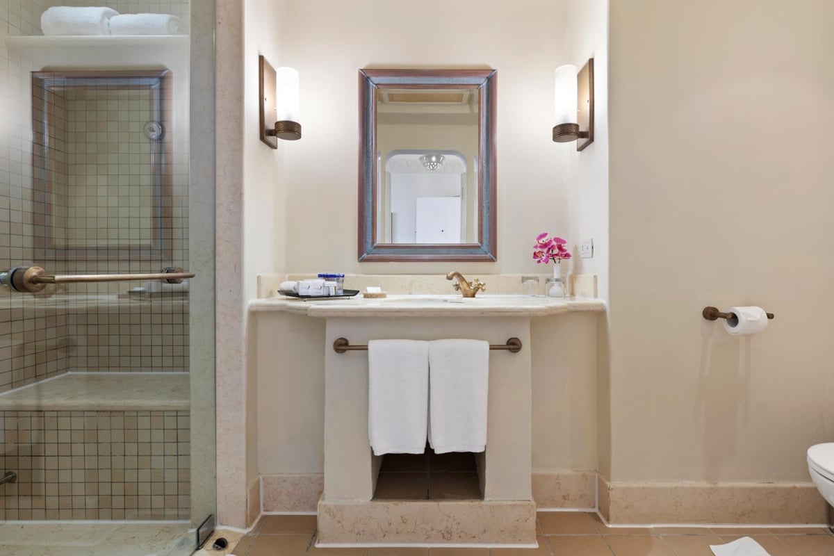 Pickalbatros Sands Port Ghalib bathroom with a vanity and tiled shower.