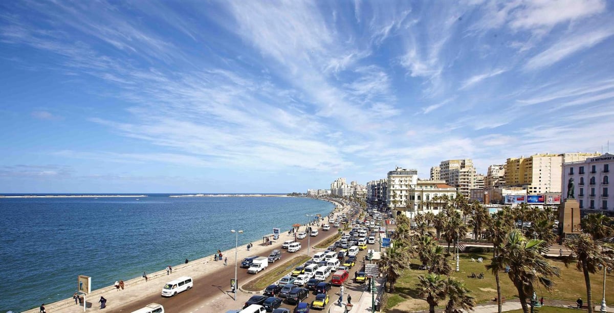 Steigenberger Cecil Hotel Alexandria coastal view with open water and waterfront buildings.