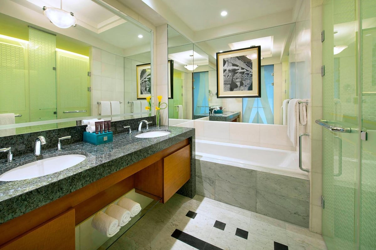 Nile Ritz-Carlton Cairo bathroom with a double vanity and a bathtub.