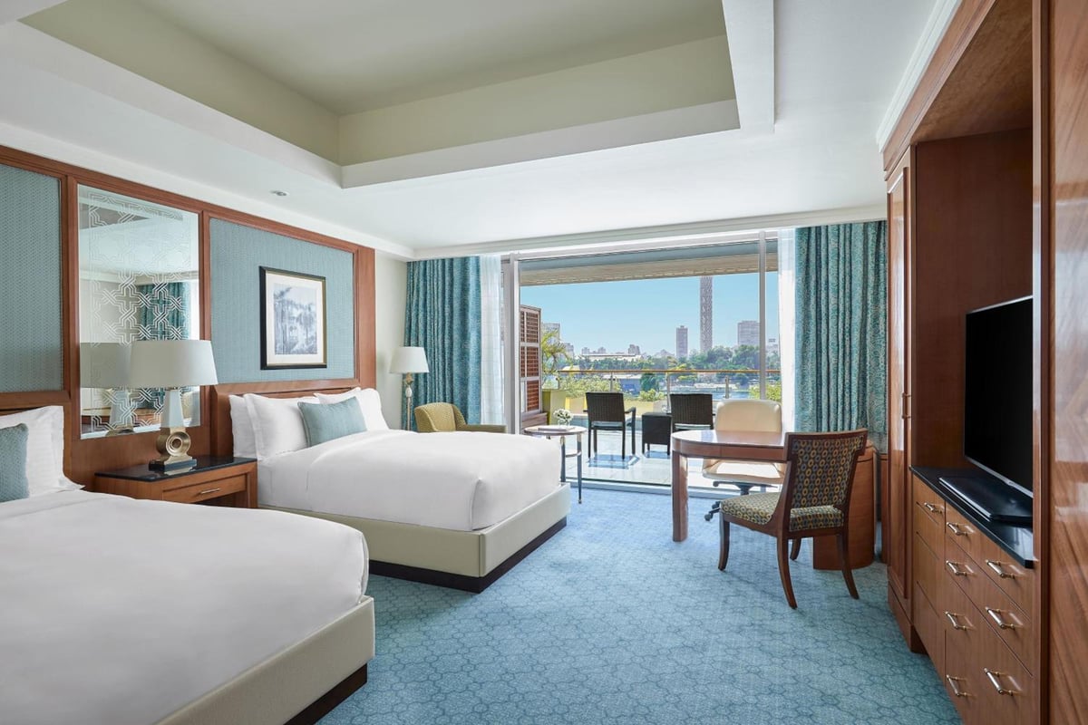 Nile Ritz-Carlton Cairo twin room with balcony and two beds.