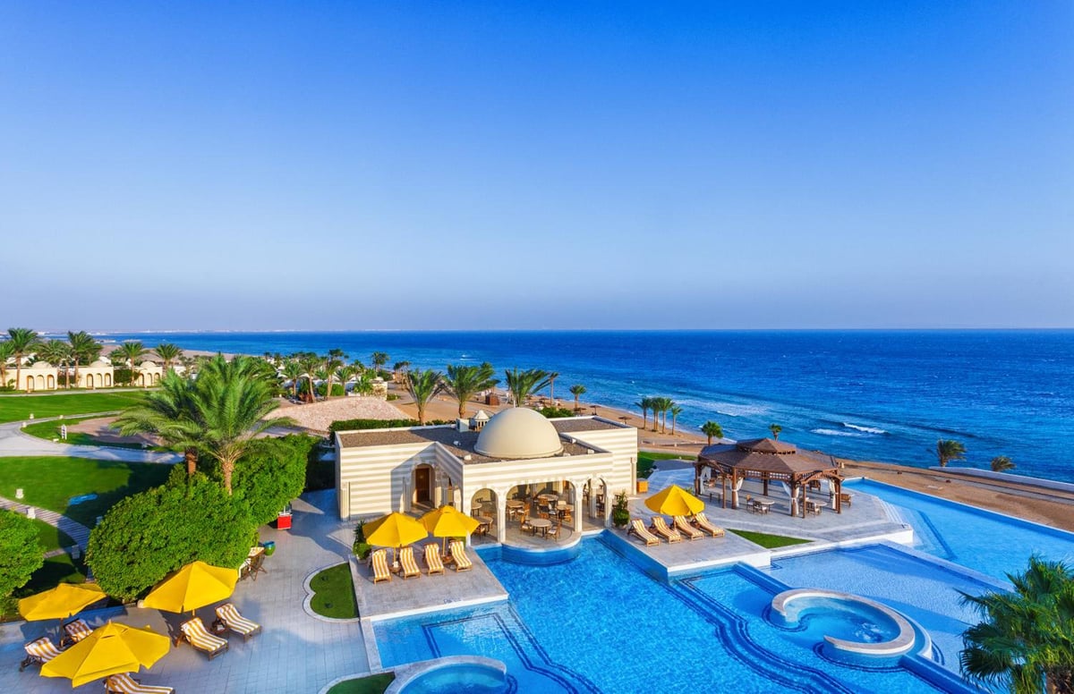 The Oberoi Sahl Hasheesh pool area with a large pool and a sea view.