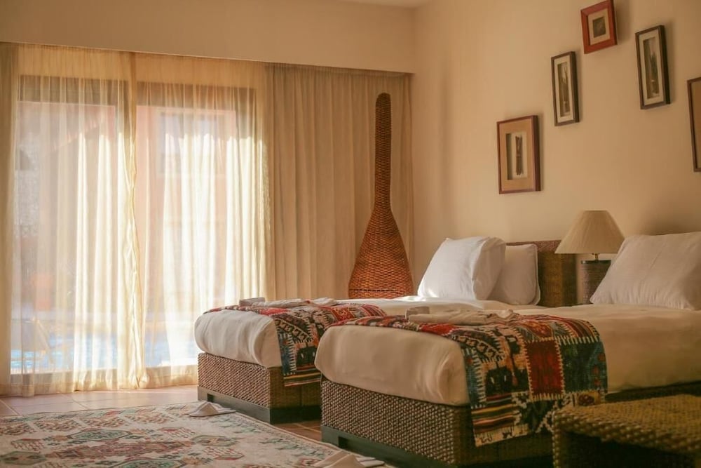 Amarina Jannah Resort & Aqua Park twin room with two beds and patterned bedspreads.