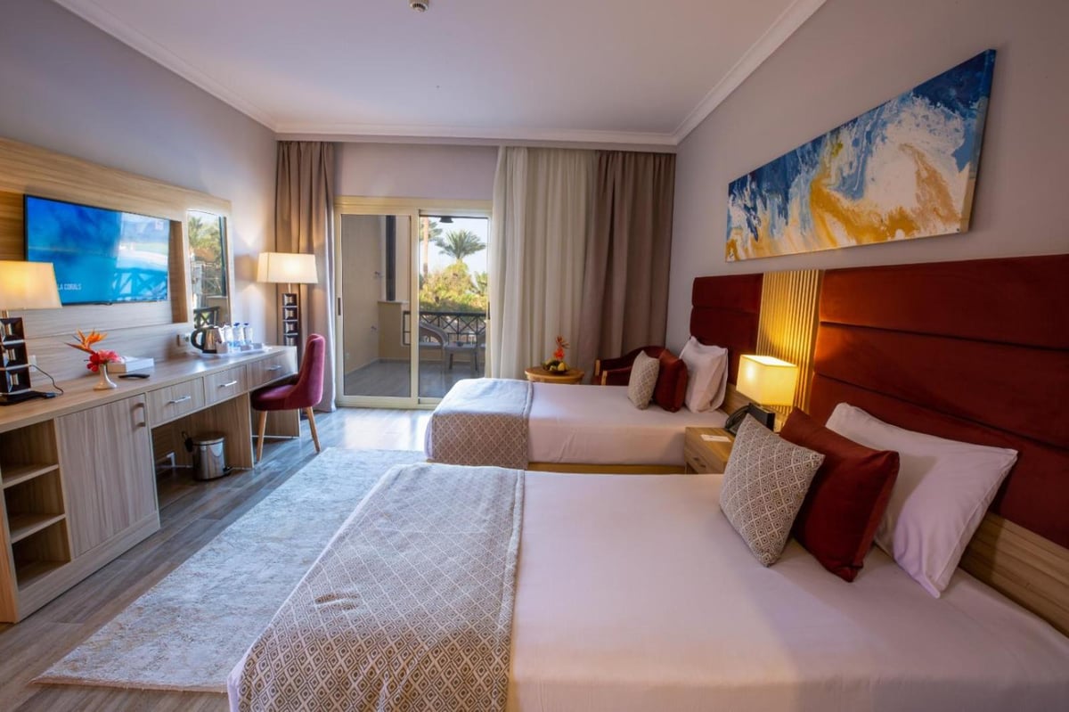 Stella Beach Resort & Spa Makadi Bay twin room with two beds and a balcony.
