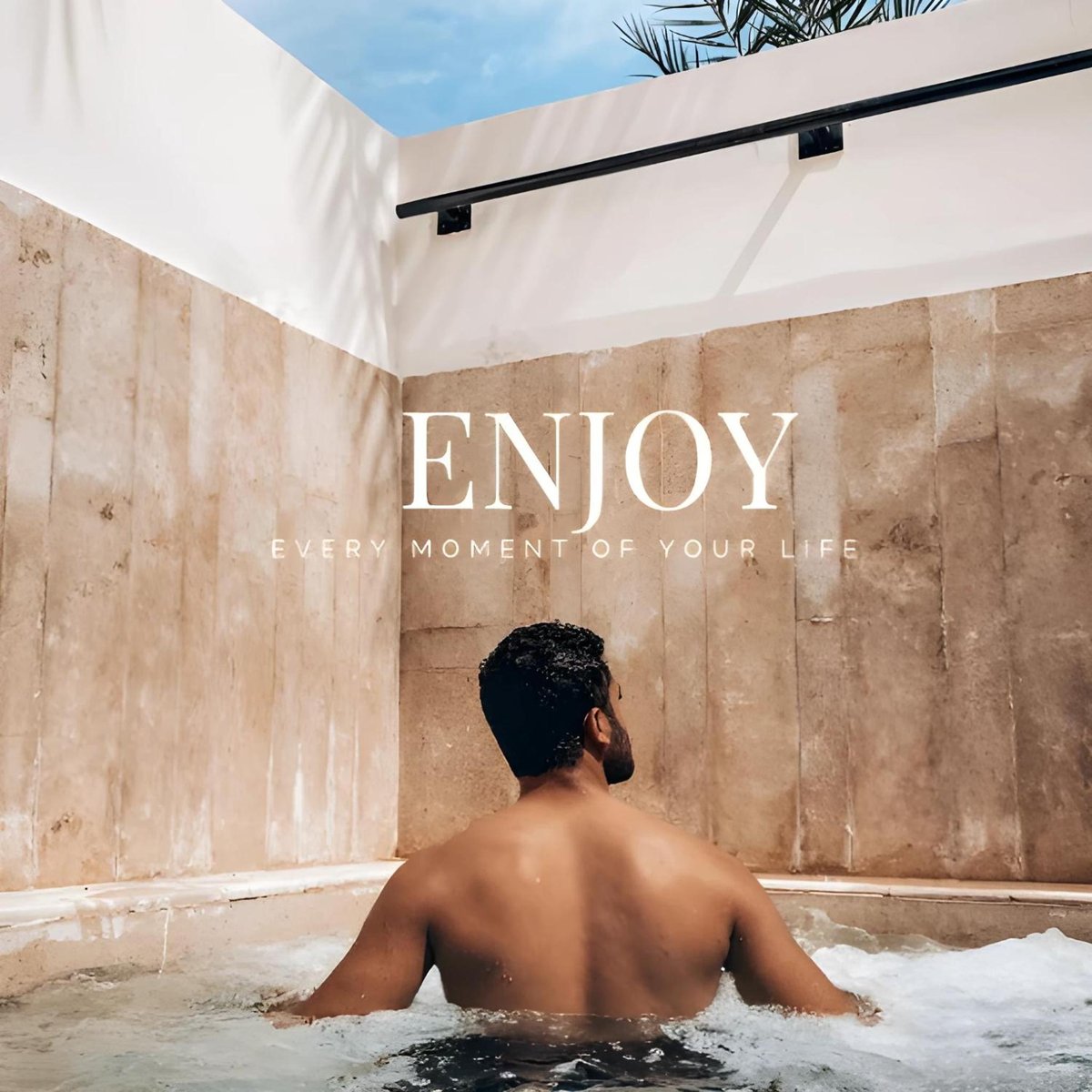 Retac Qunay Dahab Resort & Spa hot tub with a seated guest and stone walls.