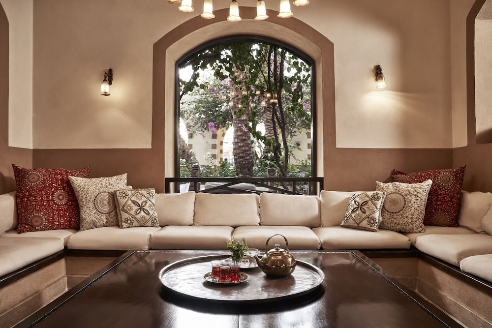 Dawar El Omda Hotel El Gouna (Adults Only) lounge with an arched window and sectional seating.