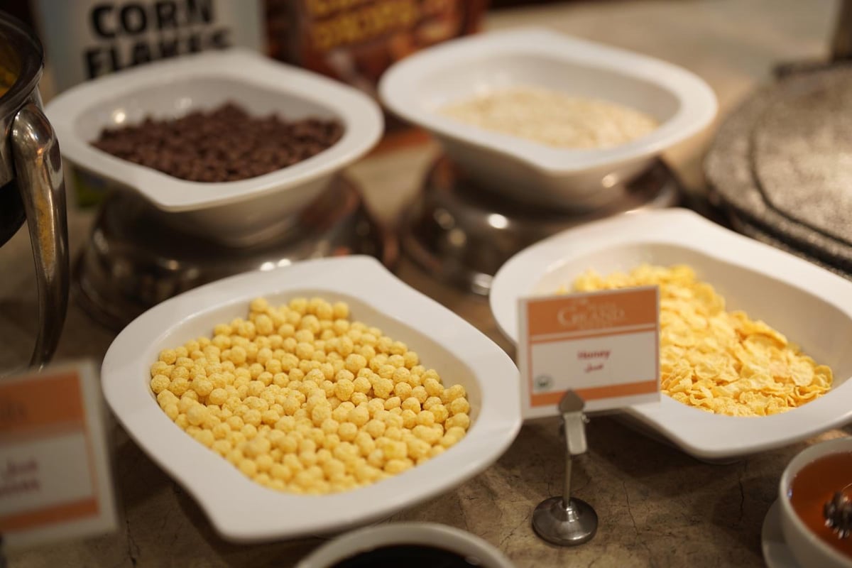 The Grand Plaza Hotel Smouha cereal buffet with bowls of cereal and breakfast flakes.