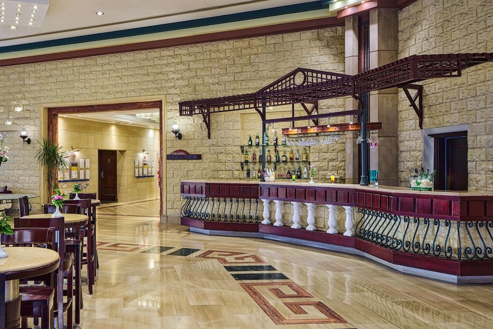 Dreams Beach - Sharm El Sheikh lobby bar with stone walls and patterned marble floor.