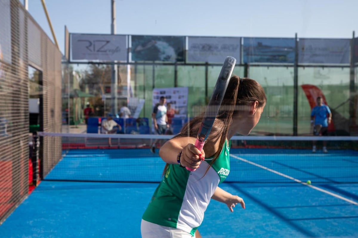 Royal Savoy Sharm El Sheikh padel court with a blue playing surface and glass walls.