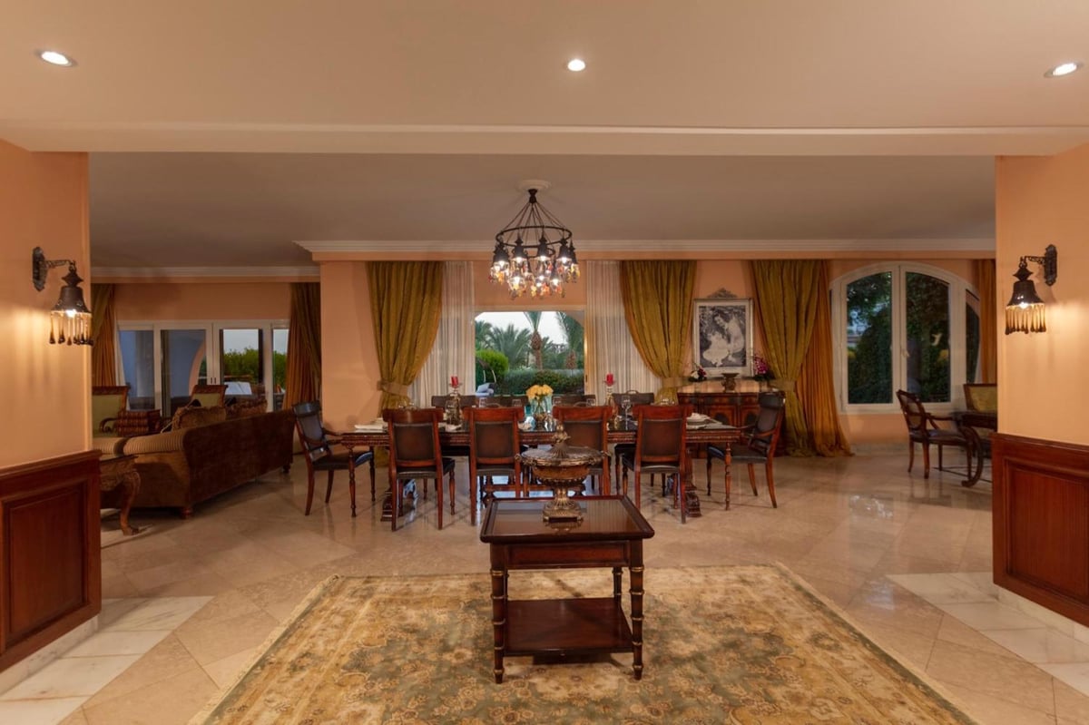 Royal Savoy Sharm El Sheikh lounge with seating and a chandelier.
