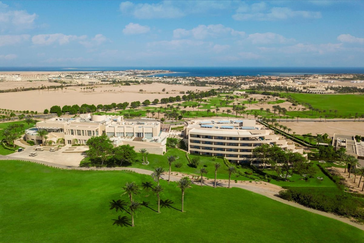 Steigenberger Makadi (Adults Friendly 16+) resort grounds with landscaped lawns and low-rise buildings.