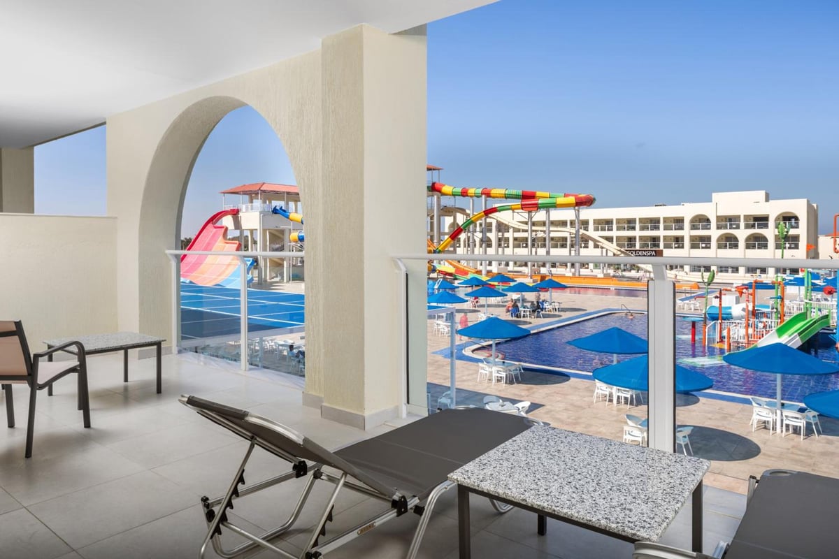 Albatros Makadi Resort terrace with an arched opening and water slides.