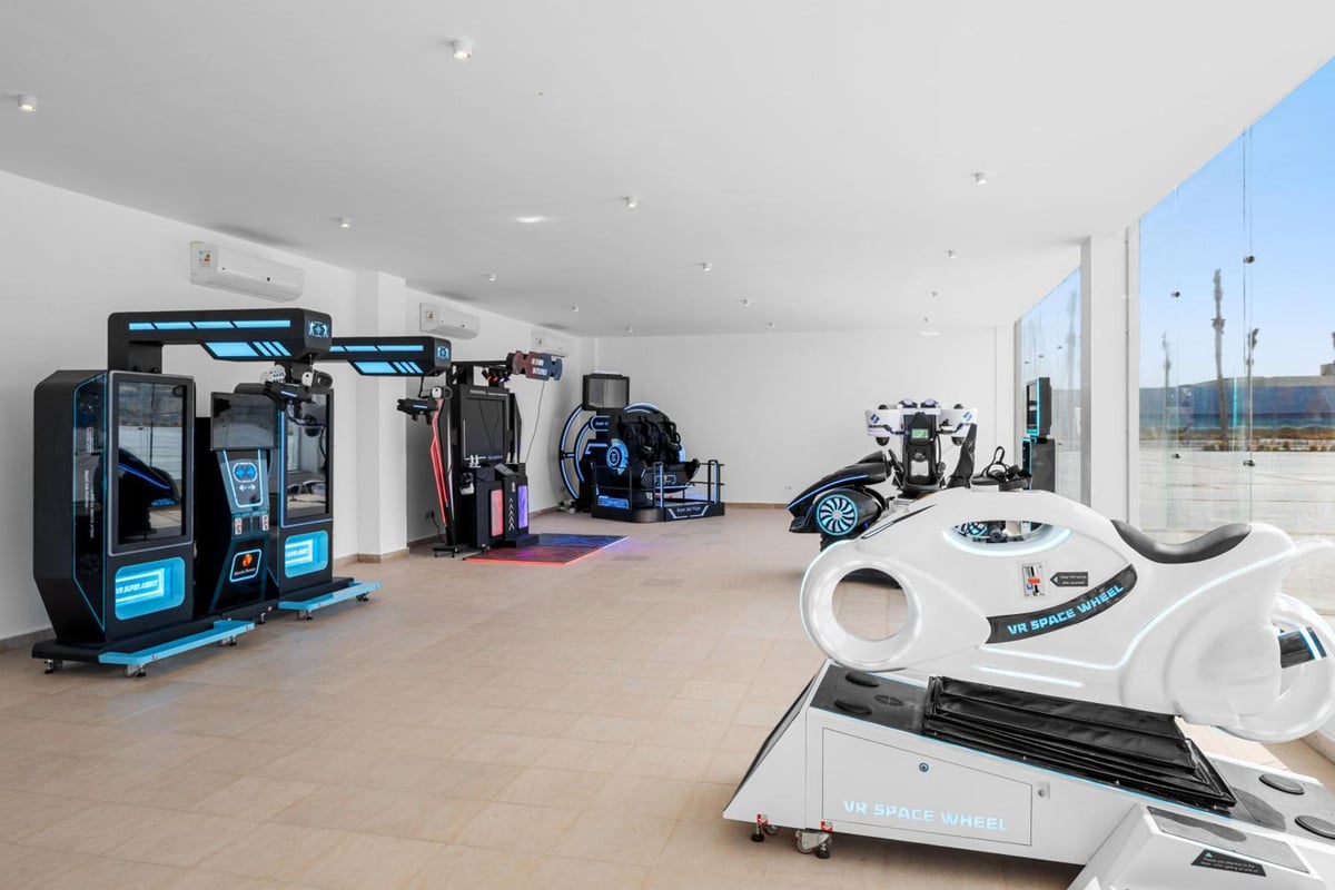 Albatros Makadi Resort fitness room with exercise machines and glass walls.