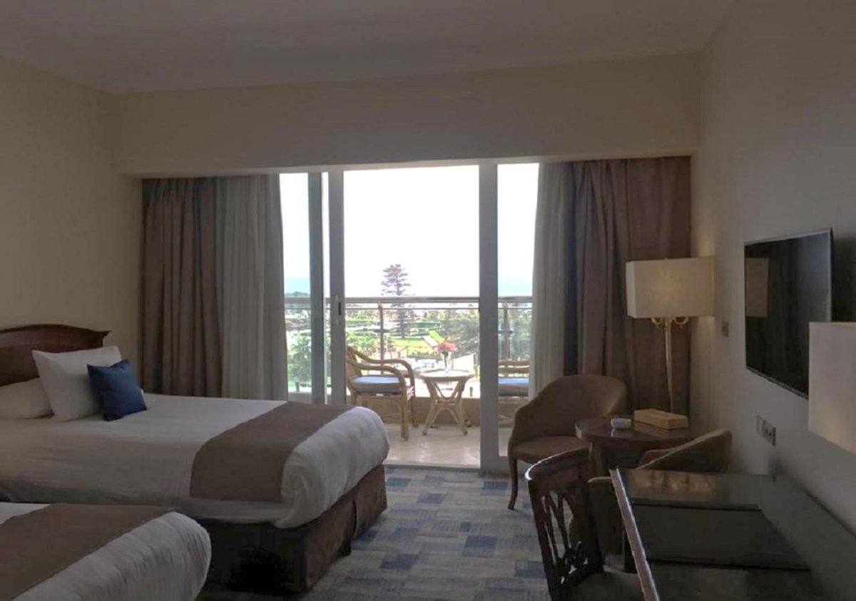 Palestine Montaza Alexandria guest room with two beds and a balcony.
