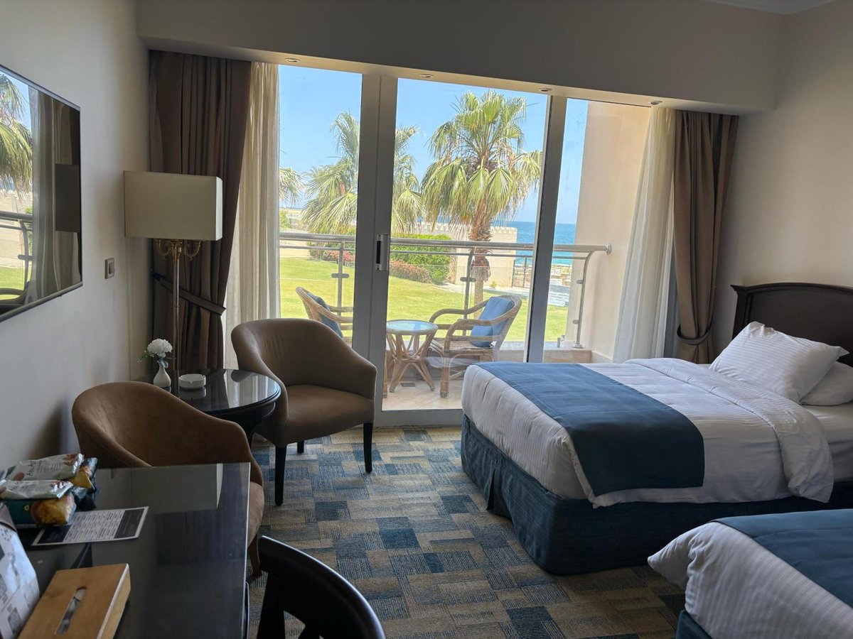 Palestine Montaza Alexandria guest room with a balcony and garden view.