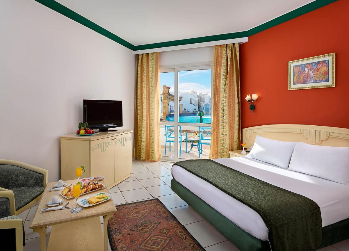 Dreams Vacation - Sharm El Sheikh double room with balcony and pool view.