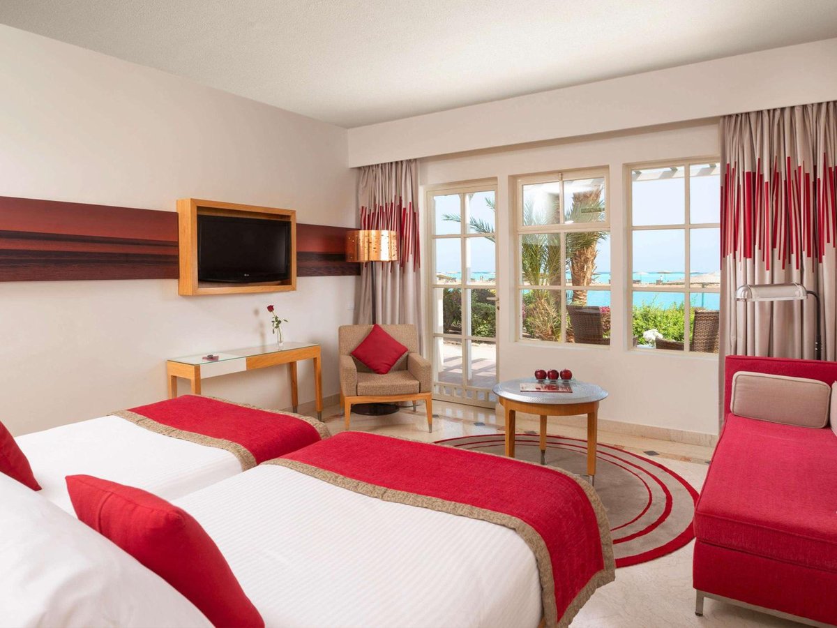Movenpick Resort & Spa El Gouna twin bedroom with twin beds and a water view.