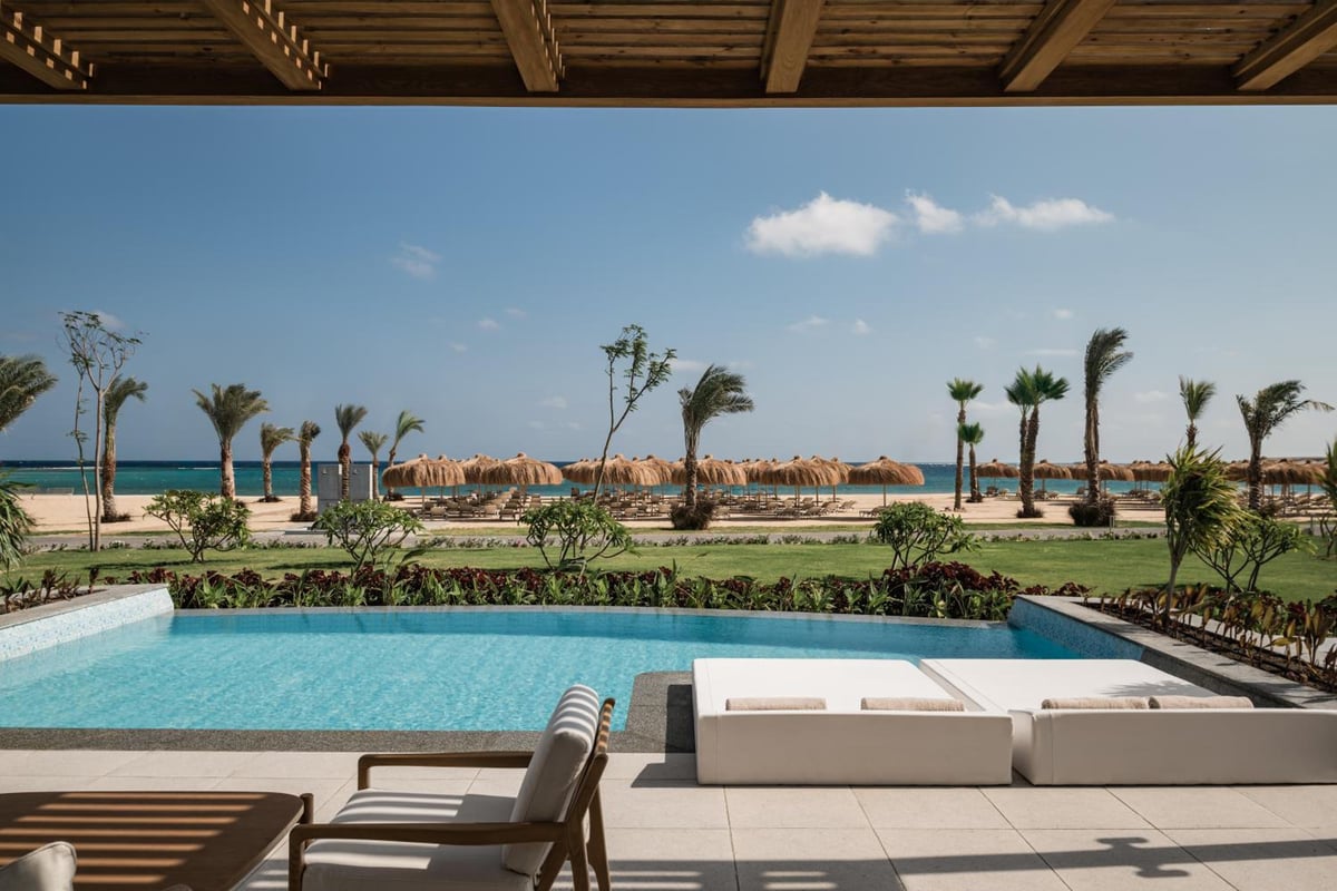 JAZ Elite Riviera pool terrace with a rectangular pool and sea views.