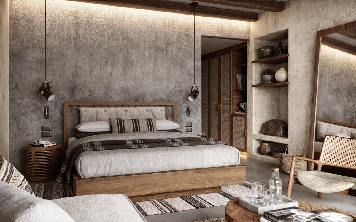 JAZ Elite Riviera guest bedroom with a wooden bed and textured walls.