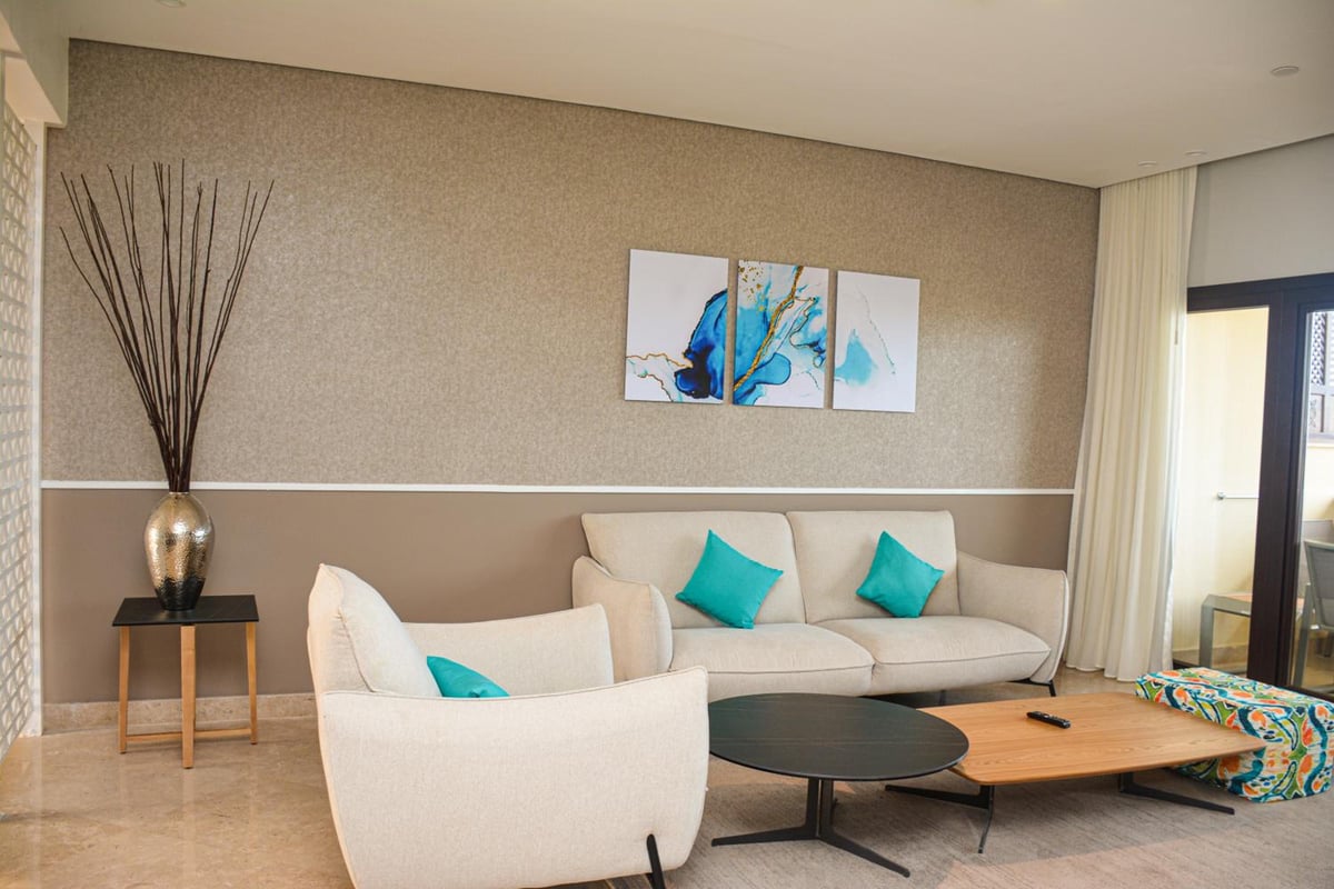 Steigenberger Aldau Beach Hotel sitting area with a sofa and armchairs.