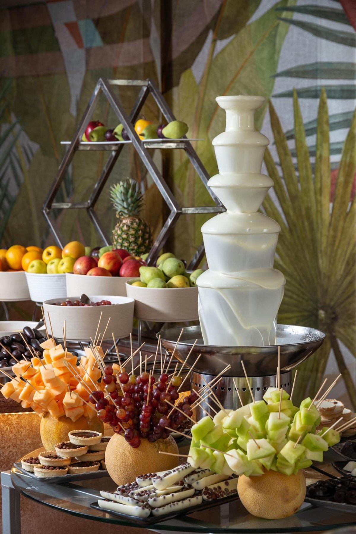 Cleopatra Luxury Resort Makadi Bay buffet with a fruit display and a tiered fountain.