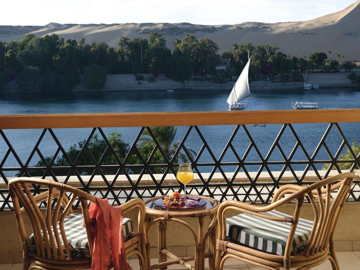 Movenpick Resort Aswan terrace with wicker seating and a river view.