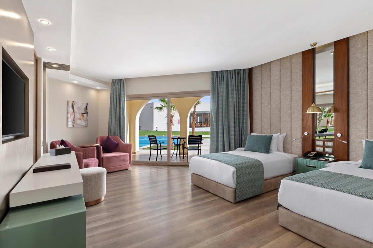 Xanadu Makadi Bay guest room with twin beds and patio doors.