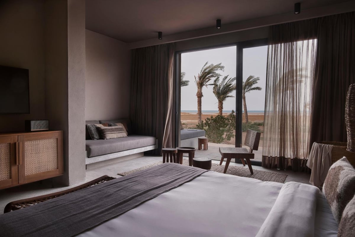 Casa Cook El Gouna (Adults Only) guest room with a low bed and full-height windows.