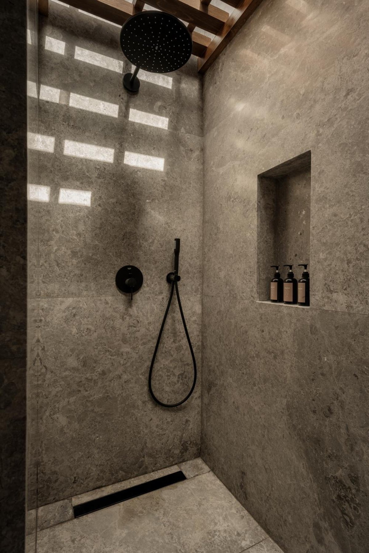 Casa Cook El Gouna (Adults Only) shower with a ceiling-mounted showerhead and recessed shelf.