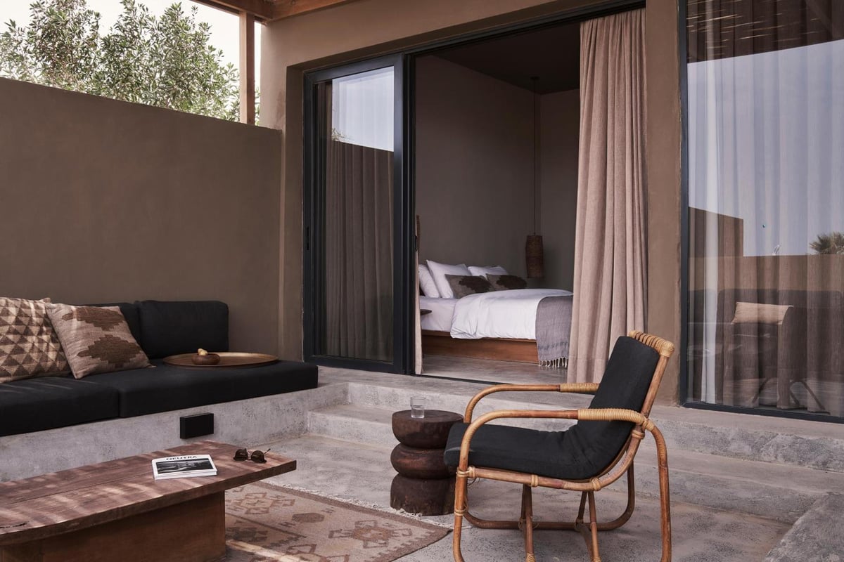 Casa Cook El Gouna (Adults Only) terrace with a built-in sofa and an outdoor chair.
