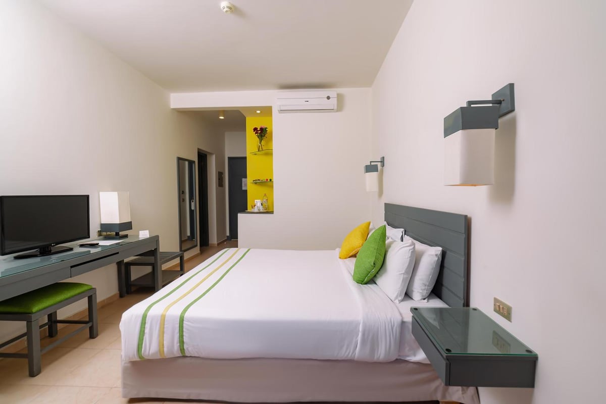 Lemon & Soul Makadi Garden guest room with a bed and a desk.