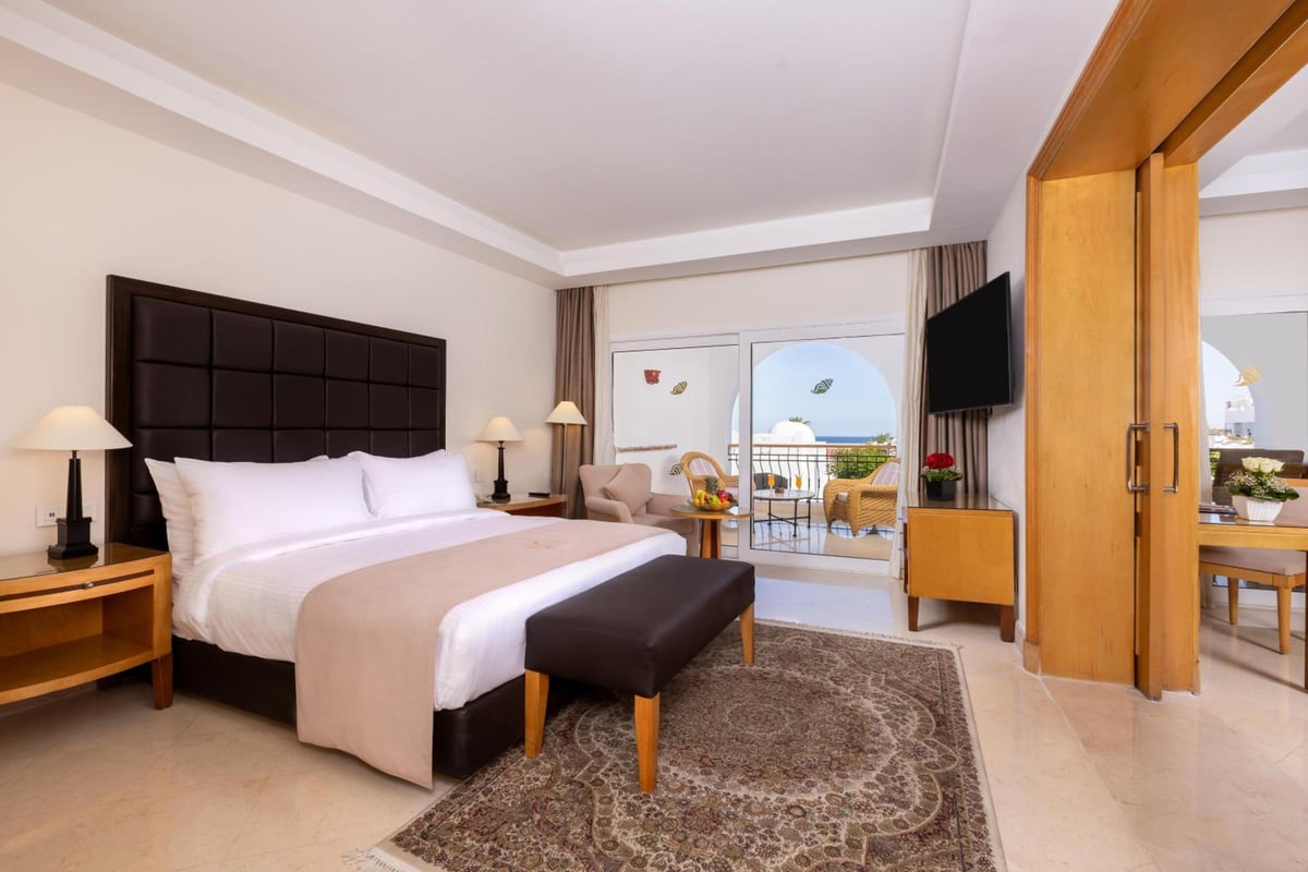 Savoy Sharm El Sheikh guest room with a bed and balcony.
