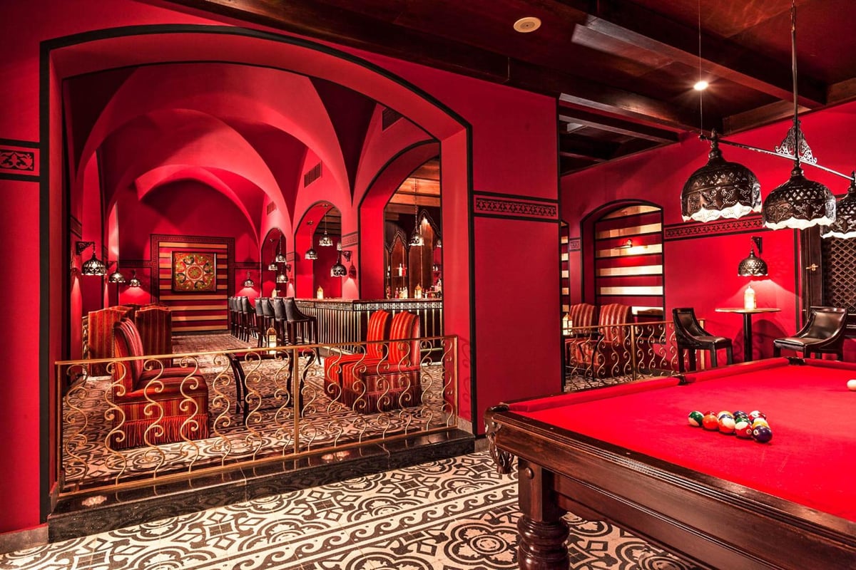 Steigenberger Coraya Beach (Adults Friendly 16+) billiards room with red pool table and patterned floor.