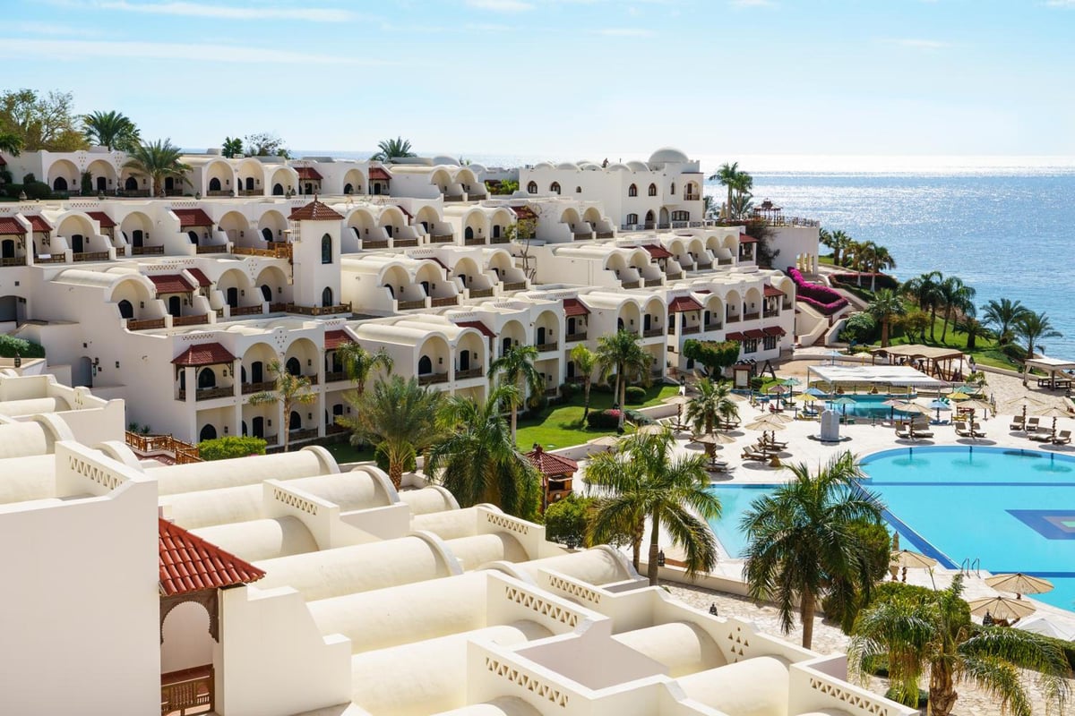Movenpick Resort Sharm El Sheikh resort grounds with white buildings and swimming pools.