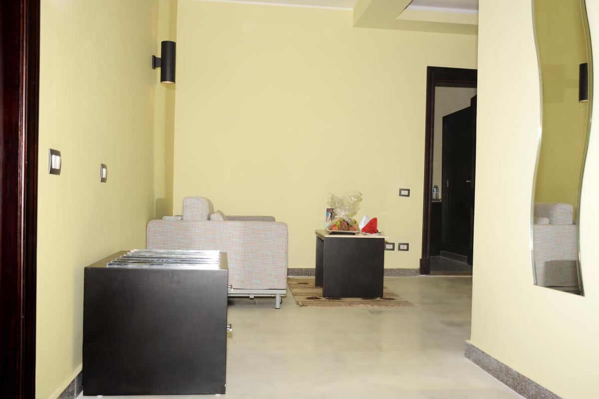 Casa Mare Resort Marsa Alam lobby with upholstered seating and black tables.
