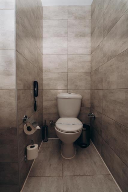 Long Beach Resort Hurghada toilet room with tiled walls and a toilet.