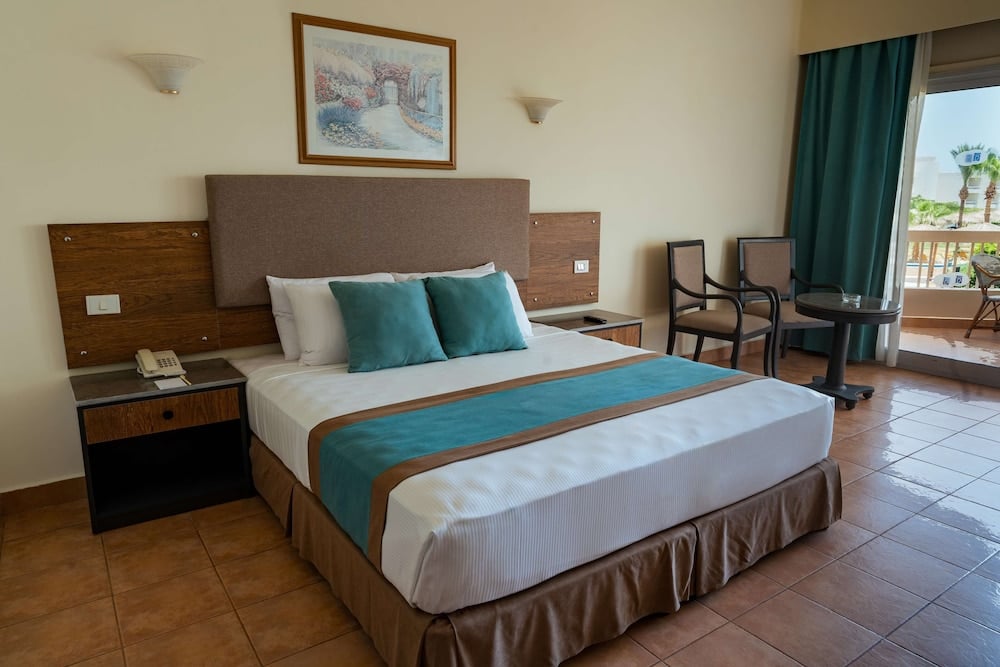 Long Beach Resort Hurghada guest room with double bed and balcony.